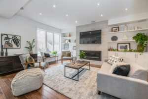 Staged living room with concrete fireplace